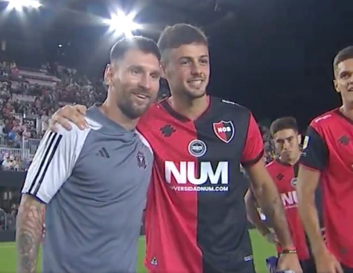 Lionel Messi pictured (left) posing for a photograph with Ian Glavinovich following a 1-1 draw between Inter Miami and Newell's Old Boys in Florida in February 2024